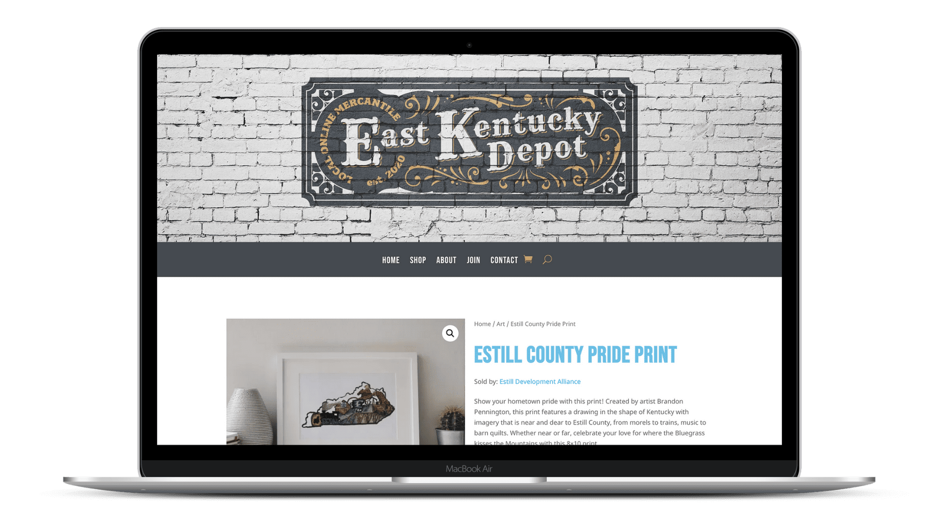 A laptop featuring the East Kentucky Depot Online Mercantile, a website designed by Alight Marketing Agency 